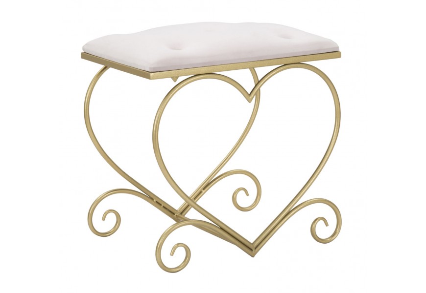 Dizajnová glamour obdĺžniková taburetka Amorattia s konštrukciou z kovu v zlatej farbe v tvare srdca s čalúneným sedadlom so zamatovým poťahom v ružovej farbe s okrúhlymi dekoratívnymi gombíkmi