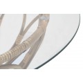 Etno okrúhly ratanový konferenčný stolík Lania s vrchnou sklenenou doskou so vzorovanou vypletanou kovovou nohou 75 cn