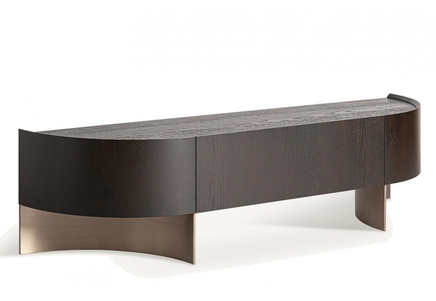 Luxusný tmavohnedý art deco TV stolík Davaro zaobleného tvaru s úložným priestorom so zásuvkou s push-to-open mechanizmom s dizajnovými kovovými polkruhovými nožičkami v mosadznej farbe