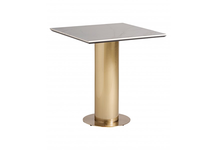 Luxusný glamour barový stôl Boas s nohou z kovu vo valcovom tvare v zlatej farbe a vrchnou doskou z porcelánu v bielej farbe s mramorovým vzhľadom so sivými žilkami