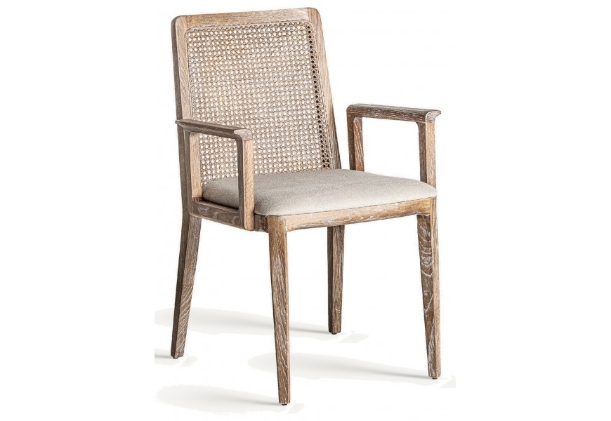 Luxusná vintage jedálenská stolička Isabella s bielou patinou na nožičkách z masívneho jaseňového dreva v hnedej farbe s ratanovým viedenským výpletom s čalúnením a poťahom z ľanu v sivej farbe
