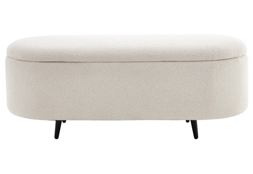 Dizajnová oválna lavica s úložným priestorom, čalúnená krémovou bouclé látkou s jemnou textúrou, doplnená čiernymi kovovými nožičkami, ideálna do moderných, škandinávskych alebo glamour interiérov