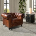 Luxusné chesterfield kreslo Hastings s poťahom z pravej kože v koňakovom hnedom odtieni s dizajnovými kolieskami 120 cm