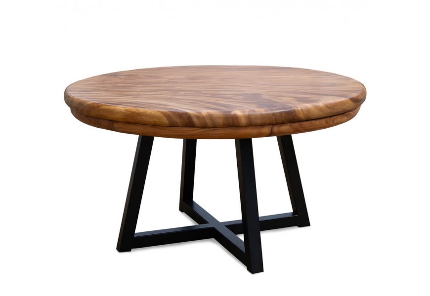 Luxusný industriálny jedálenský stôl Juviano s okrúhlou vrchnou doskou z dreva suar v výraznou kresbou letokruhov s medovej hnedej farbe s podstavou s kovu zo štyrmi nohami v krížovou základňou