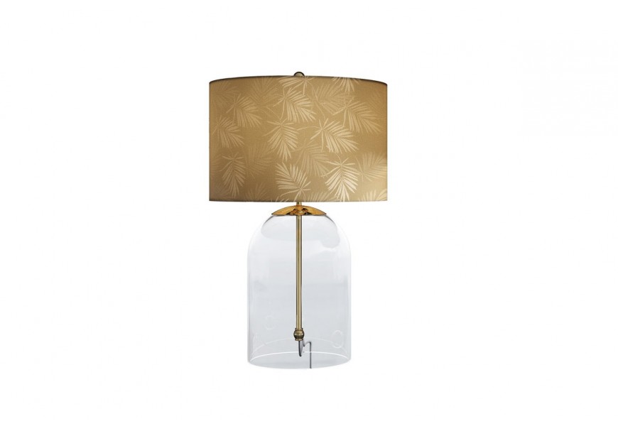 Glamour zlatá sklenená stolná lampa Gambier s priehľadnou nohou v tvare zvonu so zlatou kovovou konštrukciou a okrúhlym textilným tienidlom s asymetrickým motívom palmových listov v odtieňoch zlatej