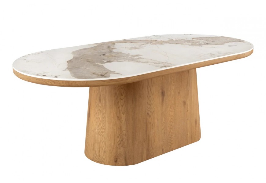 Luxusný art deco jedálenský stôl Marmol Lignia s bielou keramickou doskou s mramorovým efektom a masívnou oválnou podstavou z dubového dreva