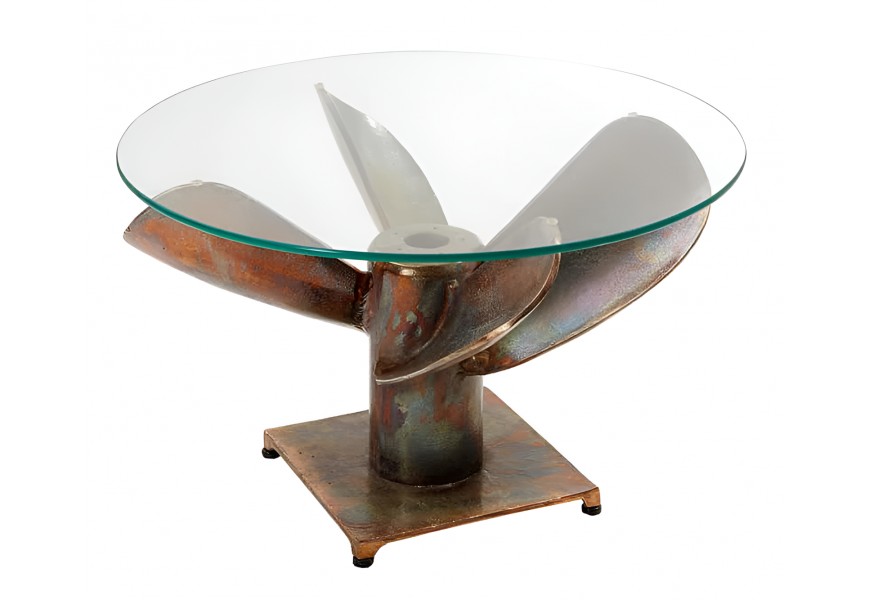 Industriálny okrúhly konferenčný stolík s čírou sklenenou doskou a podstavou z kovovej lodnej vrtule s patinovaným povrchom