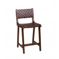 Koloniálna barová stolička Timal bez opierok rúk z lakovaného tmavého teakového dreva s výpletom z pravej hnedej kože a drevenou opierkou na nohy