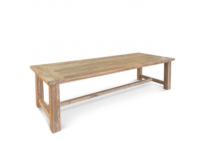 Luxusný vintage masívny jedálenský stôl Pagano z recyklovaného teakového dreva v naturálnej svetlej hnedej farbe so starožitnou patinovanou povrchovou úpravou so štyrmi nohami prepojenými dlhou lineárnou spojnicou v strede