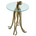 Nápaditý príručný stolík s okrúhlou sklenenou doskou a výraznou podstavou v tvare chobotnice z kovu so zlatou povrchovou úpravou – originálny dizajn pre odvážne interiéry.