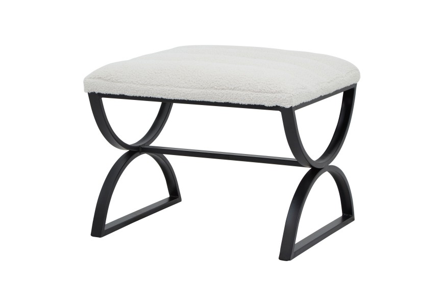Art deco taburetka Ark s obdĺžnikovým tvarom s čiernym kovovým rámom s oblúkovými nohami a krémovým rebrovaným buklé poťahom