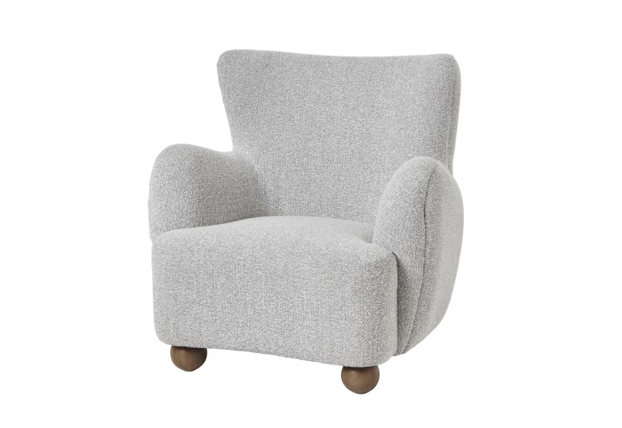 Luxusné dizajnové škandinávske kreslo Nuyen typu ušiak s textilným poťahom s výraznou štruktúrou v svetleom béžovo sivom odtieni greige s nožičkami okrúhleho tvaru z masívneho dreva v naturálnej hnedej farbe