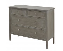 Vintage komoda Montclair z masívneho dreva so štyrmi zásuvkami, kovovými úchytkami a vysokými zužujúcimi sa nožičkami v prírodne sivom odtieni