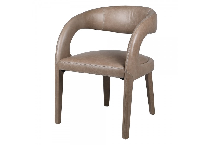 Dizajnová jedálenská stolička Leslie s béžovým koženým poťahom s atypickou oblou tvarovanou opierkou s otvorom medzi operadlom a sedadlom a s nožičkami potiahnutými kožou