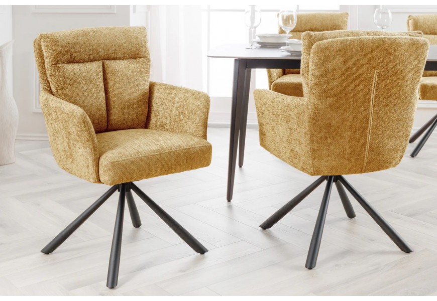 Dizajnová retro otočná čalúnená horčicovo žltá stolička Dover s dekoratívnym prešívaním na vysokej chrbtovej opierke s čiernou kovovou podstavou