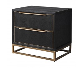 Luxusný glamour nočný stolík Millie v obdĺžnikovom tvare s čiernym eko koženým povrchom so zlatým rámovaním a so štíhlou kovovou podstavou v zlatej farbe s dvomi zásuvkami
