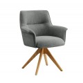 Moderné otočné čalúnené jedálenské kreslo Corvin s hranatou chrbtovou opierkou a vytočenými bočnými opierkami s poťahom v sivej farbe s plyšovej ženilkovej textílie s výrazným tkaním so štyrmi šikmými masívnymi nožičkami z dubového dreva v naturálnej svetlej hnedej farbe