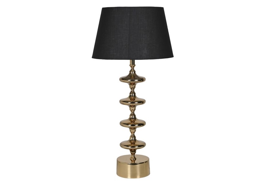 Glamour stolná lampa Aurora Gold v zlatej farbe s kovovou nohou s diskami a okrúhlou podstavou s bavlneným čiernym tienidlom