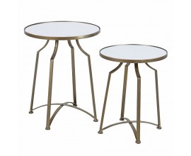 Dizajnová zrkadlová glamour sada dvoch príručných stolíkov Liven s okrúhlymi vrchnými doskami so štyrmi prehnutými nožičkami s priečkou v tvare x z kovu v zlatej farbe s patinou s matným povrchom