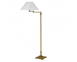 Luxusná art deco stojaca lampa Tarkten s nohou so štvorcovou podstavou a nastaviteľným ramenom z kovu v mosadznej zlatej farbe so štvorcový tienidlom s rozšírenou spodnou časťou z ľanu v bielej farbe