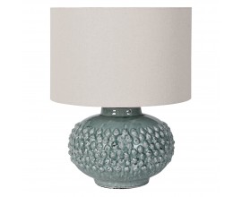 Dizajnová keramická stolná lampa Gladis s okrúhlou keramickou podstavou s reliéfnymi okrúhlymi výbežkami v pastelovej tyrkysovo modrej farbe s lesklou glazúrou s okrúhlym tienidlom s ľanovej textílie v bielej farbe