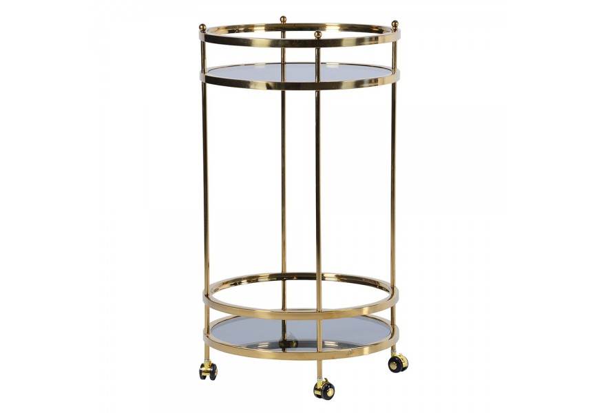 Dizajnový glamour servírovací vozík Tianna s dvomi okrúhlymi doskami zo skla so sivým dymovým efektom s konštrukciou na kolieskach z kovu v zlatej farbe