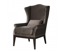 Luxusné vintage sivé kreslo Jude v taupe odtieni so zamatovým poťahom a vankúšom s vysokou chrbtovou opierkou s bočnicami a podstavou so štyrmi nohami z dreva v tmavom hnedom lakovaní