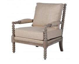 Luxusné dizajnové kreslo Boia s masívnym rámom z mahagónového dreva v svetlej hnedej farbe s vyrezávanými guličkami na opierkach a nožičkách s čalúnením s poťahom v béžovej farbe zo zmesi ľanu a mikrovlákna